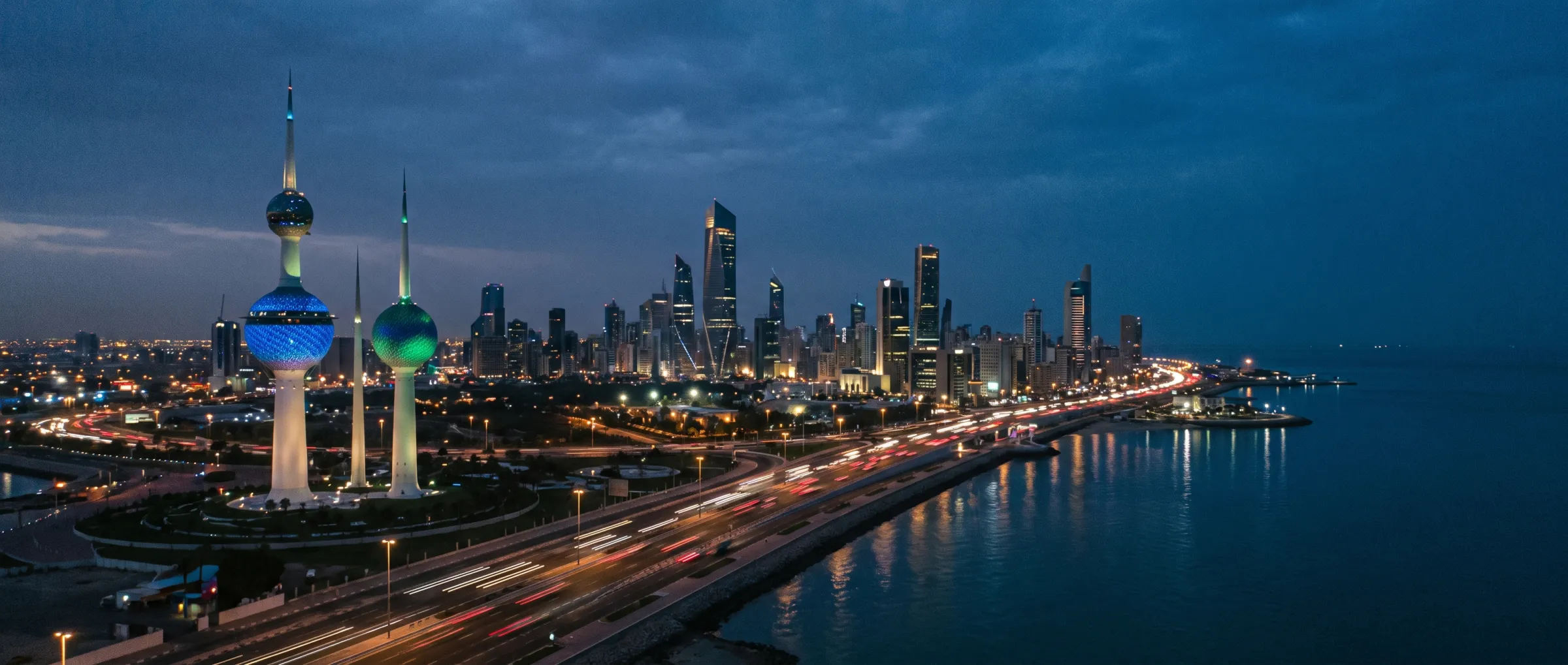 Kuwait City at dusk, the coastal expressway along the Gulf front